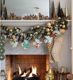 a fireplace decorated for christmas with stockings and ornaments