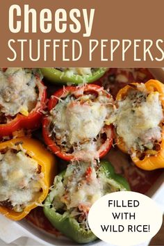 cheese stuffed peppers in a white casserole dish with the title overlay reads, filled with wild rice