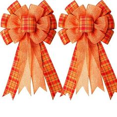 two orange bows with plaid patterns on them