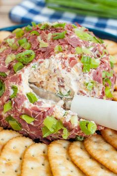 a platter with crackers and cheese on it