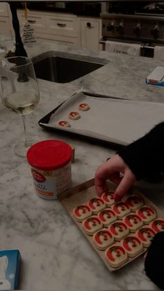 a person making cookies on a kitchen counter