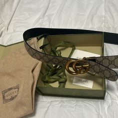 Worn Once- No Scratches Or Issues. Missing The Tiny Piece To Tuck The Belt Loop In If Too Big. Size 105.42 Gucci - Fits Women Size 10/12. This Is The Reversible One Where You Can Twist The Gg Buckle And It Can Be Either Brown Logo Or Black Belt. Comes With Box, Literature, And Dust Bag. Fully Authentic And Purchased From Gucci Store. Gucci Store, Brown Logo, Gucci Marmont, Browning Logo, Fits Women, Reversible Belt, Gucci Accessories, Black Belt, Big Size