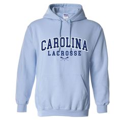 Gildan Carolina Blue Hoodie 8.0 oz. Heavy Blend Hooded Pullover. Double-lined hood with matching drawstring. Set-in sleeves. Double-needle throughout. 1x1 athletic rib with spandex, pouch pocket. Two color screen print on front. Original design copyright Teamzila 2022. Lacrosse Sweatshirt, Lacrosse Hoodie, Light Blue Hoodie, Hockey Hoodie, Dad Shorts, Floral Hoodie, White Crewneck, Cool Outfits For Men, Trending Today