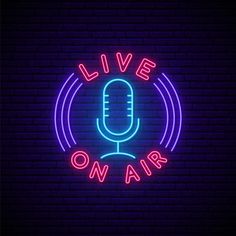 a neon sign that says live on air in front of a brick wall with a microphone