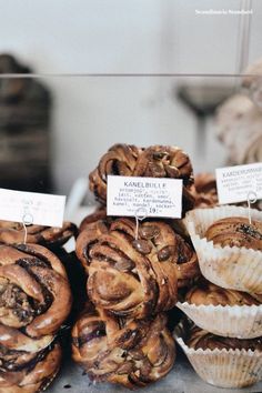 many different types of pastries are on display