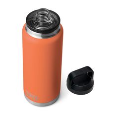 an orange water bottle next to a black lid