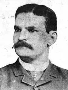 an old black and white photo of a man with a moustache on his face