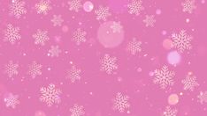 snow flakes are falling down on a pink background