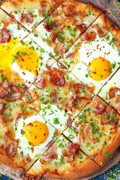 an egg and bacon pizza on a pan