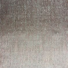 a brown and white rug with lines on it