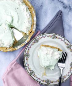 a piece of pie sitting on top of a plate next to a knife and fork