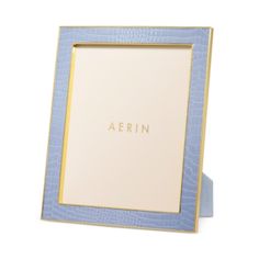 a blue and gold frame with the word aerin on it's front side