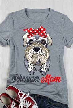 a gray shirt with a dog wearing glasses and a red bow on it's head