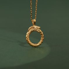 Ouroboros Dragon necklace in 10K or 14K gold for women, Ancient symbol pendant with ouroboros for best friend, Occult necklace for wife Our handmade necklaces are so versatile and make the perfect gift idea for women of all ages. Whether you're shopping for a teen, young adult, or mature woman, these pendants are sure to impress. They are perfect for birthdays, anniversaries, holidays, or any other special occasion. Their elegant, slim shape complements any outfit, and their minimalist design ensures they'll never go out of style. Crafted from 925 Sterling silver, 10K Gold, 14K Gold and 18K Gold, these jewels are of the highest quality and you can be confident they will last. The 14K Gold material also means they are hypoallergenic, so they won't irritate sensitive skin. - Finish: Oxidized Ouroboros Dragon, Ouroboros Necklace, Gold Dragon Design Round Pendant Jewelry, Silver Symbolic Snake-shaped Necklace, Gold Dragon Pendant Necklace, Brass Snake-shaped Necklace For Gifts, Gold For Women, Gift Idea For Women, Dragon Necklace