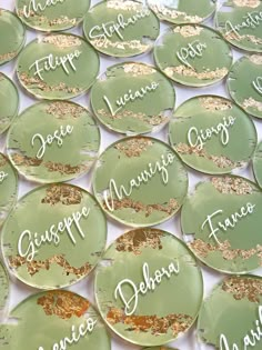 many green plates with gold confetti on them that say diaper, josepe, lumino, mariogo, francisco and fasci