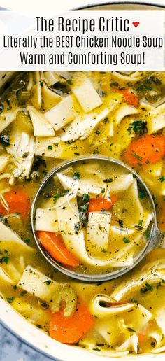 a bowl of chicken noodle soup with carrots and broccoli in it