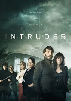 a group of people standing next to each other in front of a building with the words intruder on it