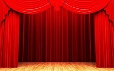 an empty stage with red curtains and wooden floor