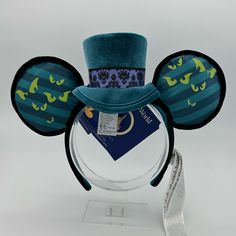 Mickey Mouse: The Main Attraction Ear Headband For Adults The Haunted Mansion Limited Releasejoin Our 999 Happy Haunts In This Collectible, Limited Release Ear Headband, Part Of A Monthly Series Themed To Beloved Walt Disney World Resort Attractions. This Top Hat-Topped Adornment Will Ease Your Eternal Rest In The Haunted Mansion. Created Especially For Walt Disney World Resort Limited Release Satin Print Ears With Velour Piping Trim And Glow-In-The-Dark Eyes Back Of Right Ear Features Golden Embroidered Walt Disney World Logo Plush Velour Top Hat With ''Wallpaper'' Print Headband Glow-In-The-Dark The Haunted Mansion Logo Printed On Side Of Band Velour Non-Slip Interior Number 10 Of 12 Haunted Mansion Mickey Ears, Peter Pan Ears, Disney Ears Hat, Disney Mickey Ears, Disney World Magic Kingdom, Bare Necessities, Main Attraction, Disney Accessories, Ear Hats