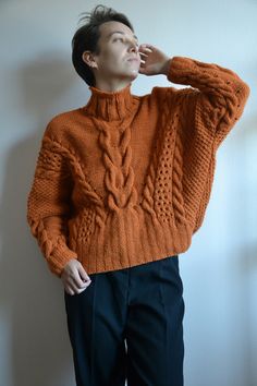 100% Hand knit SIZE: XS/S/M (Model in the photos is size S) Measurements: (Lying flat) Shoulder to shoulder - loose fit Armpit to armpit - loose fit Total length - 53 cm COLOR: orange/ rust MATERIAL: Wool - 55%; polyester - 45% CARE: Hand wash or machine wash at 30o. I would recommend to hand wash in luke warm water. Lay flat to dry on top of a towel. Shipping* I ship from Latvia EU worldwide. Estimated delivery time to: - Latvia, Lithuania, Estonia: 2-3 Business days; - European Union: 5 - 10 B Fall Knitting Pattern In Brown, Winter Chunky Knit Turtleneck Cropped Sweater, Cozy Cable Knit Acrylic Sweater, Oversized Chunky Knit Acrylic Sweater, Oversized Acrylic Cropped Sweater For Winter, Wool Turtleneck Knit Sweater, Hand Knitted Merino Wool Sweater For Fall, Merino Wool Sweater For Cold Weather In Fall, Casual Turtleneck Chunky Knit Pattern