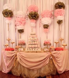 an image of a wedding cake displayed on a computer screen with pink and gold decorations