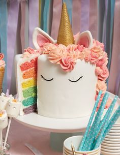 a cake with a unicorn face on it