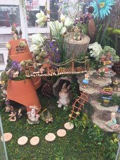 a fake garden with plants and animals in it