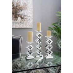 a glass table with candles on it