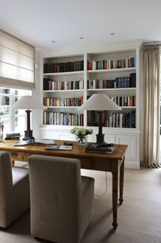 a room filled with lots of books and furniture