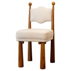 a wooden chair with a white cushion on it's seat and two wood legs