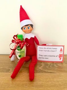 an elf is holding a bottle of toothpaste and a sign that says how do elves keep their hands clean?