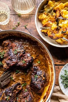 two dishes of food on a wooden table