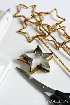 a pair of scissors sitting next to a star decoration