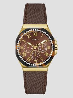 Brown leather chronograph watch Polished gold-tone case Octagonal bezel lined with crystals Multifunctional subdials Textured genuine brown leather strap Case diameter in mm: 36 Water resistant up to 30 m/ 100 ft 2 year limited warranty Brown Leather Strap, Chronograph Watch, Gold Watch, Accessories Watches, Chronograph, Women's Accessories, Leather Straps, Brown Leather, Gold Tones