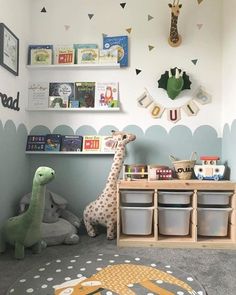 a child's playroom with toys and bookshelves on the wall above