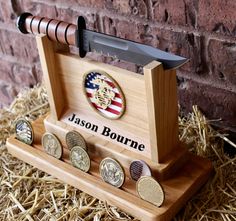 a personalized wooden knife holder with six different types of knives in front of a brick wall