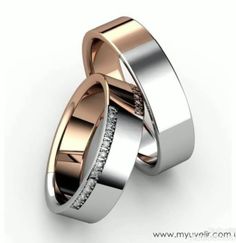 two gold and silver wedding rings with diamonds on each side, set against a white background