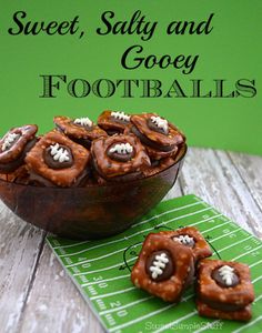 chocolate football cookies in a wooden bowl on a green tablecloth with the words sweet salty and gooey footballs