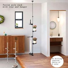 a bathroom with wooden floors, white walls and wood flooring is featured in this ad