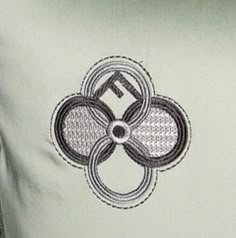 a close up view of the back of a shirt with an intricate design on it