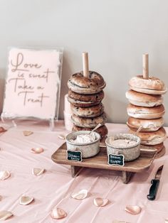 a table topped with donuts and other food items