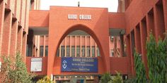 the entrance to an orange brick college building