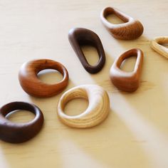 several wooden rings sitting on top of a table