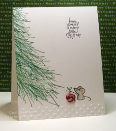 a handmade christmas card with a mouse on it