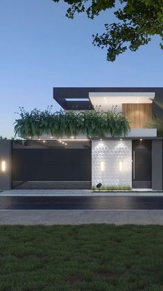 a modern house is lit up at night