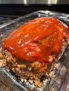 the meatloaf is covered with sauce and ready to be cooked in the oven