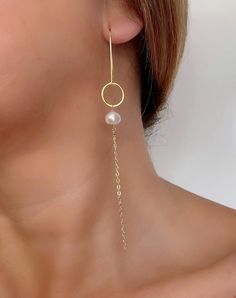 Classic and timeless, these gold pearl bridal earrings makes the perfect earrings for your wedding day! Eye-catching but at the same time extremely lightweight, these long chain drop earrings feature irregular real freshwater pearls dangling from gorgeous french hooks embellished with an open circle at the end. The pearls are hand-wrapped with 14k gold filled wire and connected with a dainty and shimmering 14k gold filled cable chain.  French hooks are gold plated over solid sterling silver. Sui Pearl Bridal Earrings, Jewelry For Brides, Dainty Wedding, Wedding Jewelry For Bride, Chain Drop Earrings, Earrings Circle, Bridal Earrings Pearl, Long Drop Earrings, Pearl Bridal