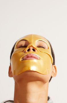 What it is: A face mask with powerful ingredients including collagen, hyaluronic acid, retinol and bakuchiol for a burst of youthful radiance.What it does: Exude opulence as this gold face mask helps restore your skin's natural beauty while bringing a bit of sparkle to your self-care routine. How to use: Begin with a clean, freshly washed face. Gently remove the mask from packaging and apply all over. Leave on for 15–30 minutes, remove the mask, and gently massage excess serum into your skin. Us Coconut Oil Mask, Jlo Glow, Skin Gym, Golden Box, Golden Mask, Gold Face Mask, Turmeric Face Mask, Collagen Facial, Skin Mask