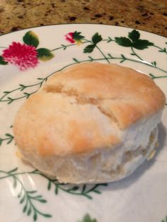 a biscuit sitting on top of a white and green plate