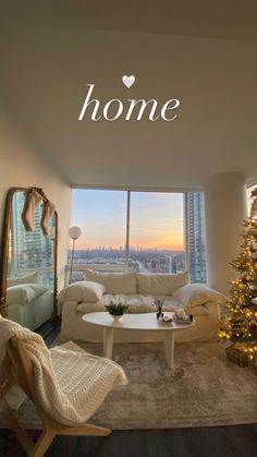 a living room filled with furniture and a christmas tree in front of a large window